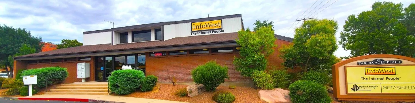 The InfoWest headquarters in St. George, a brick building with the 'The Internet People' sign.