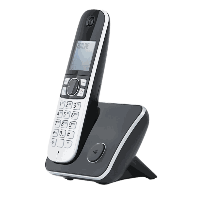 Cordless home phone handset resting on its base station