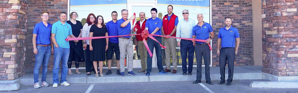 InfoWest staff and the Cedar City Chamber cutting the ribbon at the second Cedar City office