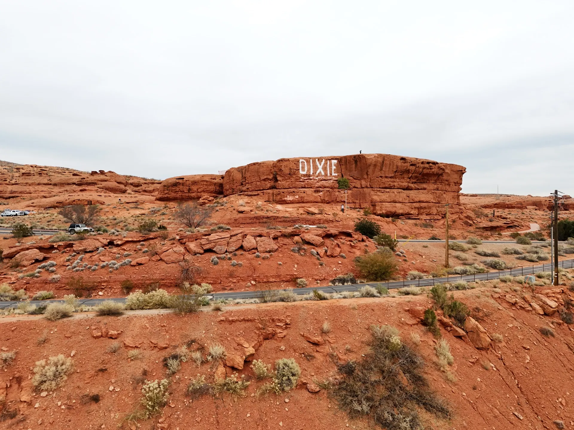 The Sugar Loaf red rock formation near St. George with 'DIXIE' painted in white across its face.