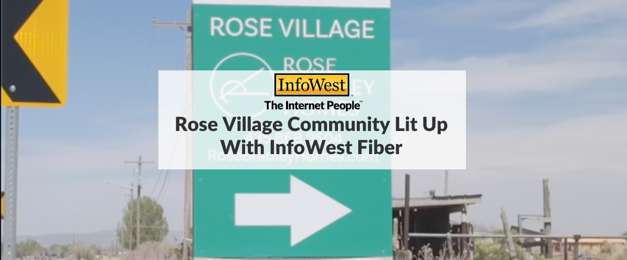Green roadside sign reading 'ROSE VILLAGE' with a large white arrow; overlay text shows the article title 'Rose Village Community Lit Up With InfoWest Fiber'.